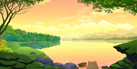 A sunset view of a lake with mountains and the orange skies.