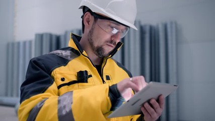 Architect or engineer working, browsing building project indoor of construction site with blueprint plan. businessman worker, man male construction engineers or architects working people. Engineer In