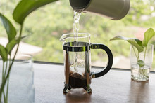 Pouring Hot Water Into The French Press Coffee Maker