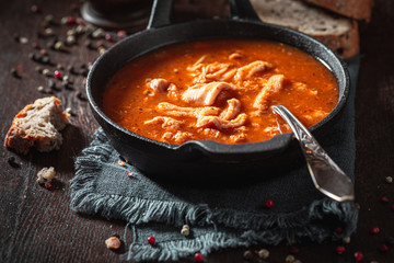 Wall Mural - Tasty tripe soup served with whole grain bread