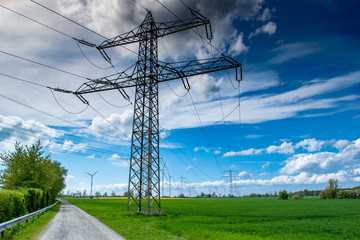 high voltage power lines on field