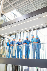 Wall Mural - Group of surgeons with medical records at the briefing