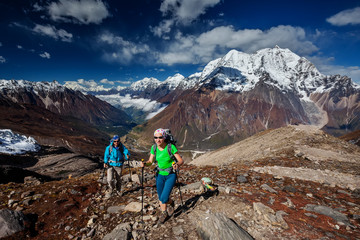 Wall Mural - hiker enjoys the view in the himalayan mountains