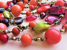 Jewelry, Choker In Boho Style. Beautiful Beads Of Different Shades Of Pink, Purple, Coral Flowers. Different Shapes And Facets. Close-up Photo. Fashion Art Design.