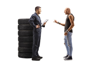 Canvas Print - Auto mechanic and a male customer talking