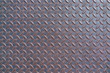 © Aleksei - Background of old rusty metal diamond plate