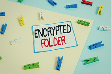 Conceptual hand writing showing Encrypted Folder. Concept meaning protect confidential data from attackers with access Colored clothespin paper reminder with yellow blue background