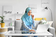 © Pixel-Shot - Muslim technical support agent working at home