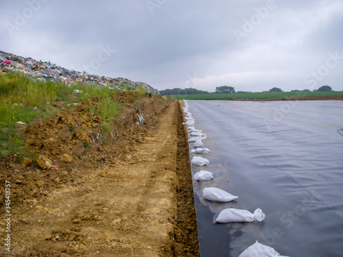 Cuadros en Lienzo Working edge of a landfill expansion project with active landfill, clay cover, a
