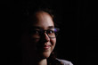 © justoomm - portrait on black with glasses mystery girl