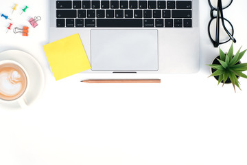 Wall Mural - Flat lay, Top view business office on white  table desk with blank yellow sticky note and laptop computer, supplies, copy space, work space