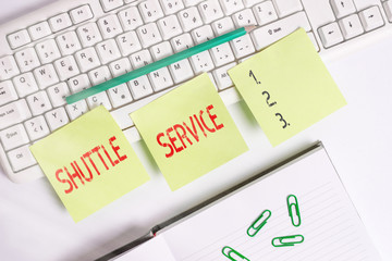 Handwriting text writing Shuttle Service. Conceptual photo vehicles like buses travel frequently between two places Three empty green square papers by the pc keyboard with copy space