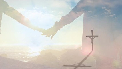 Wall Mural - Animation of a Christian cross over a Caucasian couple holding hands