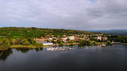 Aufkleber - aerial view on the italian city buildings on seaside yachts in lake orta on the background mountain landscape
