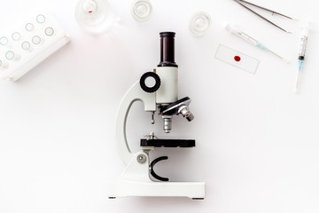 Wall Mural - Laboratory examination with microscope. Equipment on white background top view