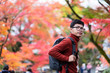 © Jo Panuwat D - Happy man tourist looking colorful leaves in the garden, young Asian traveler visit in Kyoto city, Japan and enjoying with beautiful nature in Autumn season. Vacation, Sightseeing and travel concept
