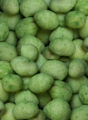 Closeup Wasabi coated peanuts.Top view , background , texture.