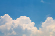 © tisomboon - white fluffy clouds in blue sky in summer day.