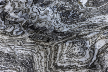 Abstract gray texture of natural, raw salt in an underground salt mine