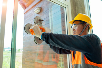 Aufkleber - Close up Technician worker at window installation in building construction site.