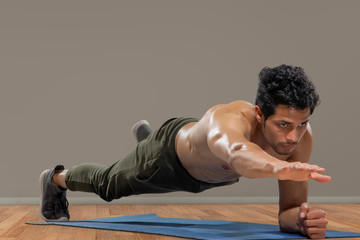 Man doing push ups with one hand.
