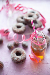 Wall Mural - Sugar donuts on pink background