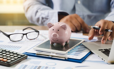 Poster - Financial Report- Business Accounting money stack Concept Business Man Using Calculator graph discussion and analysis data charts and graphs