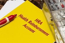 Health Reimbursement Account HRA, The Text Is Written In Red Letters On A Yellow Sheet.