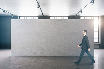 Aufkleber - Businessman walking in clean gallery interior