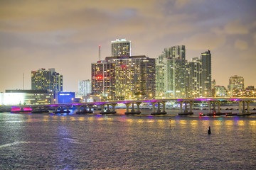 Wall Mural - Beautiful illuminated bridge of Miami at night with city skyline