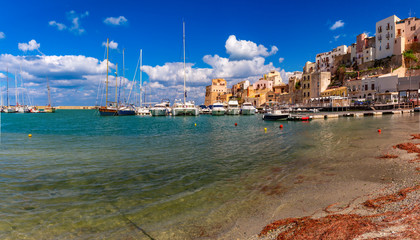 Wall Mural - Panoramic view of sunny medieval fortress in Cala Marina, harbor in coastal city Castellammare del Golfo, Sicily, Italy