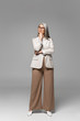 © LIGHTFIELD STUDIOS - thoughtful asian businesswoman in eyeglasses on grey