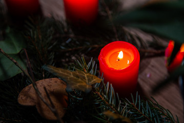 Wall Mural - Night image of bedside table with authentic Chrismas decoration and lit candles.