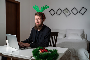 Man working during chrismas night in a authentic room.