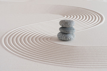 japanese garden with stone in textured sand