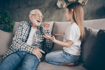 Poster - Photo of two people old grey haired grandpa little granddaughter sitting comfort sofa telling news secrets stay home house quarantine safety modern design living room indoors