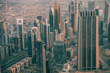 Wall Mural - Dubai skyline, skyscrapers from above in morning light. Downtown and financial center with luxury towers and hotels, United Arab Emirates.