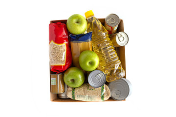 food donations set in carton box isolated on white, top view