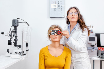 Eye test, doctor checking vision at ophthalmology clinic 