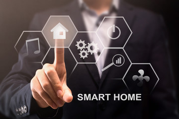 Poster - Contemporary technologies. Different smart home icons on virtual screen and man pushing house button, collage