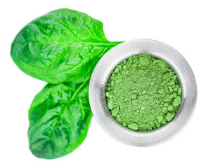 Wall Mural - Spinach powder isolated on white (close up; selective focus)
