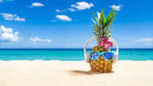 Pineapple With Sunglasses And Headphones At Tropical Beach - Holiday Vacation Concept