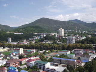 Sticker - View of the city landscape with a mountain.