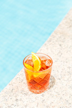 Negroni Cocktail Near A Pool At The Resort Bar Or Suite Patio. Luxury Resort, Vacation, Holiday, Getaway, Summer Time, Room Service Concept. Vertical
