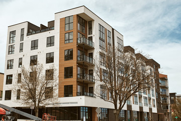 Commercial businesses and modern condominium developments in the Lower Highlands neighborhood of Downtown Denver (LoHi).  Denver, Colorado