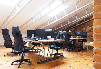 Wall Mural - Coworking office interior with computers on desktop and furniture