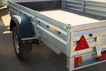 Car Open Trailer.A Store That Sells Car Trailers. Repair And Maintenance Of Trailers For Passenger Cars.