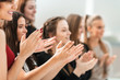 © yurolaitsalbert - close up. diverse young people applauding together .