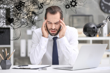 Canvas Print - Stressed man with mess in his head in office