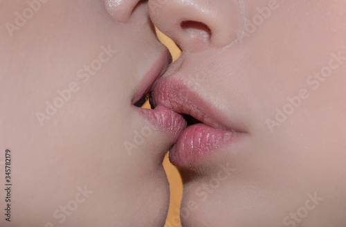 Tongue lesbian girl mouth, sexy woman concept. French Kiss. Two women oral sex. Sensual kiss in same-sex couple close up. Taste and body love for women, sex between girls, homosexual family